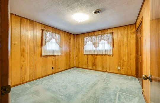 bedroom, closet, paneling walls, windows