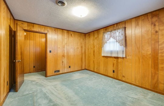 bedroom, paneling walls, carpet, windows