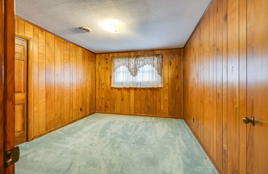 bedroom, closet, paneling walls, windows, carpet