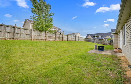 back yard, patio, fencing, back of home, vinyl siding