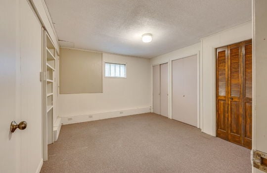 bedroom/office/bonus room, closets, carpet, built in shelving, window