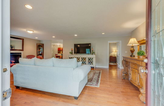Living room, hardwood flooring, fireplace, recessed lighting