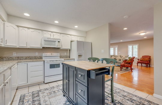 kitchen, granite countertops, recessed lighting, white cabinets, refrigerator, oven/range, built-in microwave, dishwasher, tile flooring