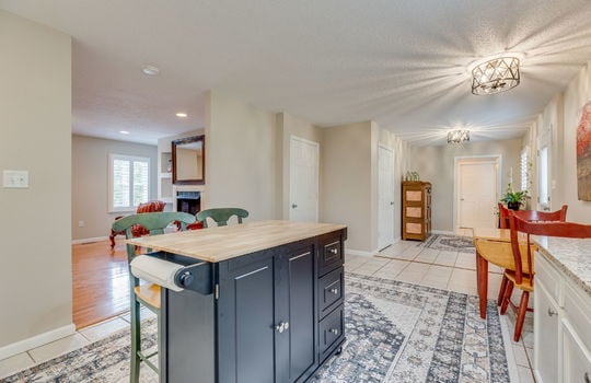 kitchen, breakfast nook, granite countertops, tile flooring, exterior door