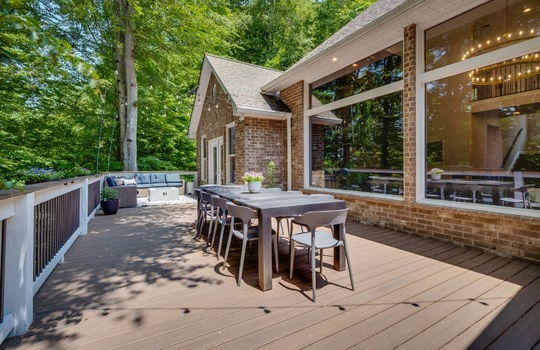 deck, deck railing, brick exterior, exterior entry doors