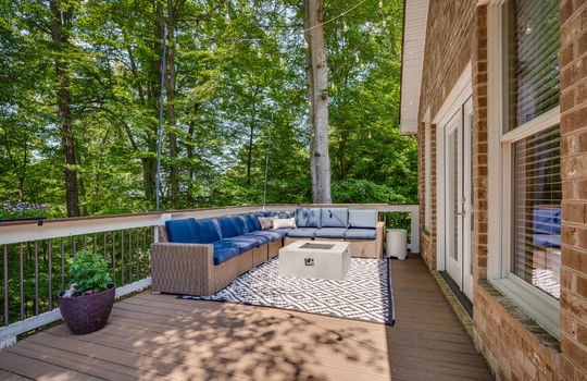 back deck, deck railing, exterior entry doors, exterior brick, windows