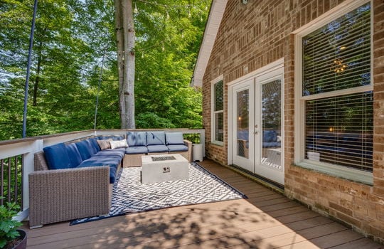 back deck, deck railing, exterior entry doors, exterior brick, windows