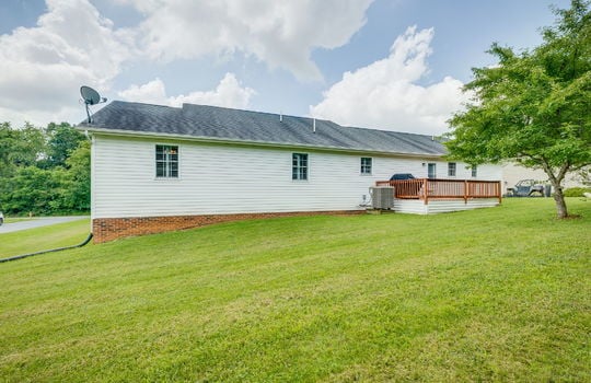 back yard, back deck, back of home, vinyl siding, shingle roof, landscaping