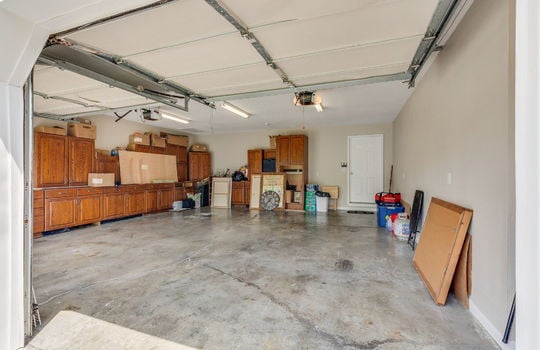 garage, garage doors, concrete flooring, interior door