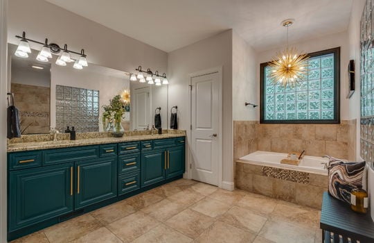 primary bathroom, cabinet, dual vanity, linen closet, tile flooring