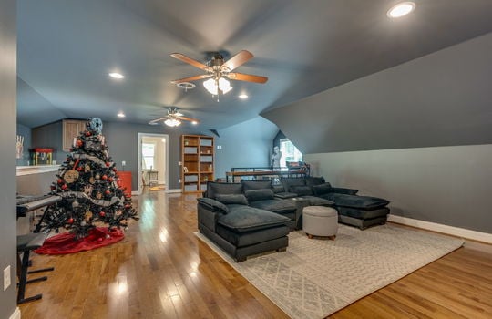 media/game room, ceiling fans, recessed lighting, hardwood flooring, windows
