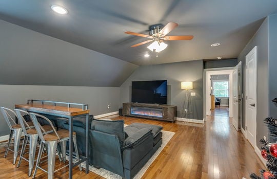 media/game room, ceiling fans, recessed lighting, hardwood flooring, windows