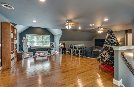 media/game room, ceiling fans, recessed lighting, hardwood flooring, windows