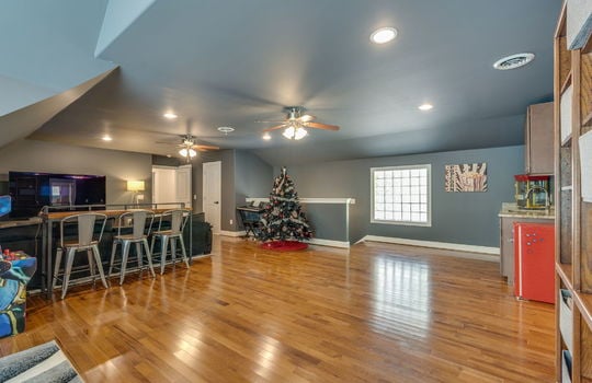 media/game room, upper level, ceiling fans, recessed lighting, hardwood flooring