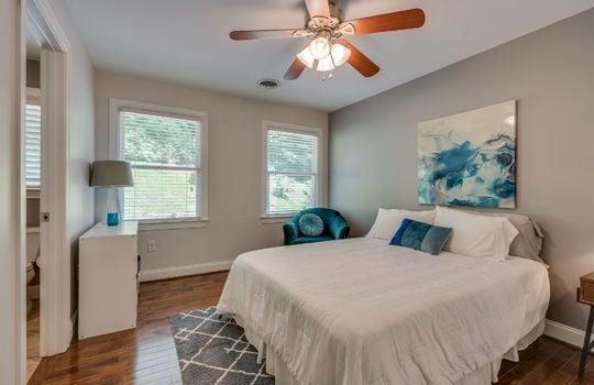 bedroom, hardwood flooring, ceiling fan, windows, ensuite bathroom