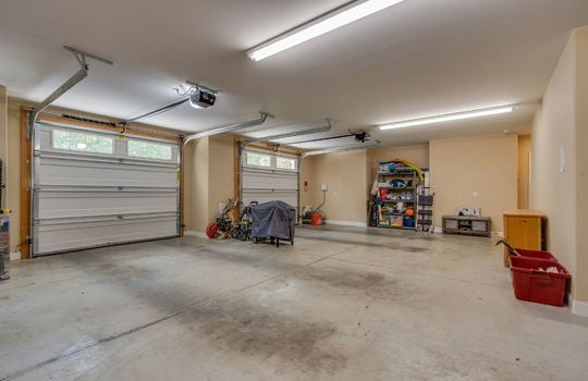 garage, concrete flooring, three garage doors, 3 car garage