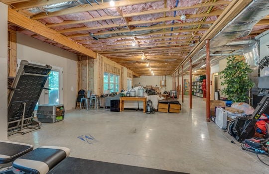 Basement, concrete flooring, windows, exterior doors