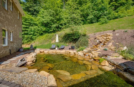 landscaping pond, landscaping waterfall, rock pond, back yard, brick home exterior