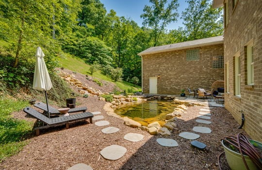 back patio, landscaping pond, landscaping waterfall, paver stone walkway, back yard
