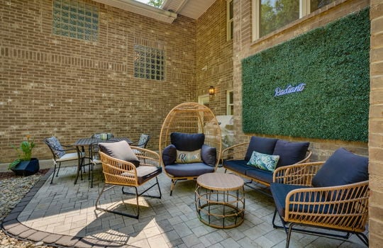 back deck, brick home exterior, patio, exterior entry door, windows