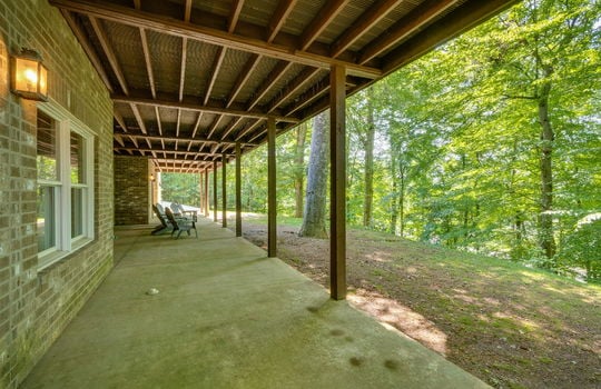 covered back patio, concrete pad, brick exterior, yard