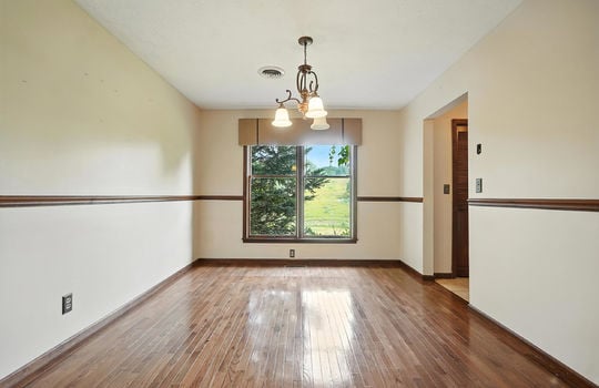 formal dining room, window, hardwood flooring, wood trim