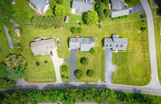 overhead aerial photo, driveway, landscaping, road, neighboring homes