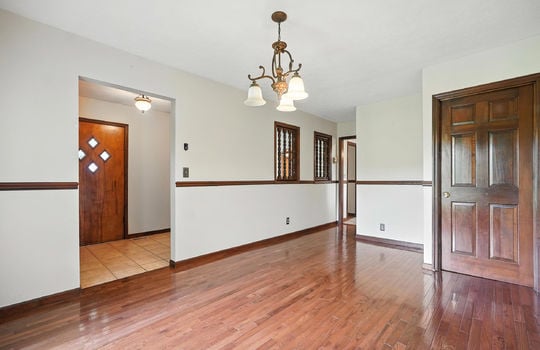 formal dining room, hardwood flooring, closet, doorway to exterior door
