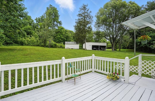back deck, deck railing, deck stairs, backyard, storage shed, carport
