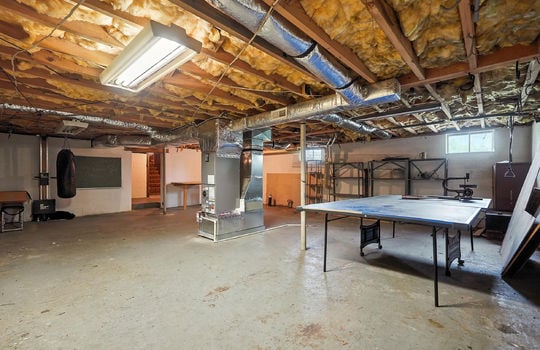 basement, concrete flooring, interior stairs