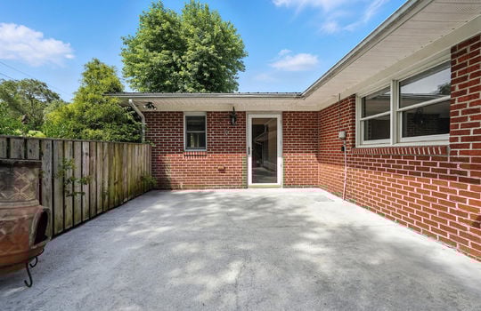 patio, concrete patio, windows, entry door, brick ranch