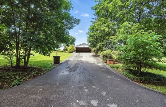 driveway, landscaping, carport, asphalt driveway