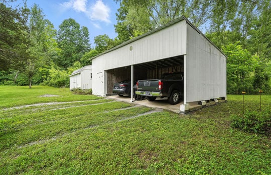 carport, storage shed, backyard, trees