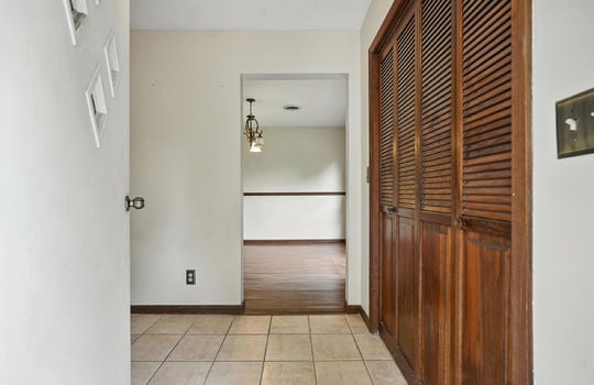 entryway, entry closet, tile flooring, front door