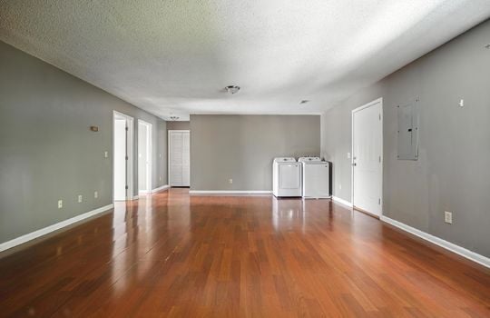 upper level apartment, living room, laminate flooring, closet, front door