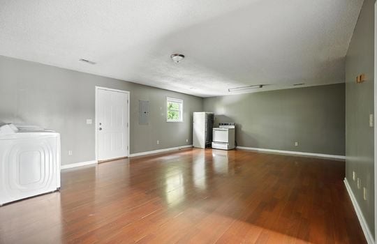 living room, laminate flooring, front door, window