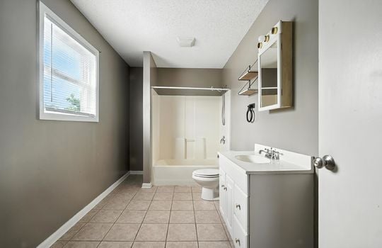 bathroom, tile flooring, sink, toilet, shower/tub