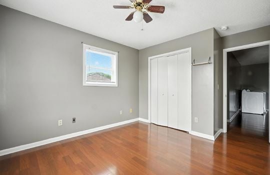 bedroom, closet, window, laminate flooring, ceiling fan