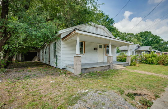 bungalow, cottage, covered front porch, front door, metal roof, sidewalk