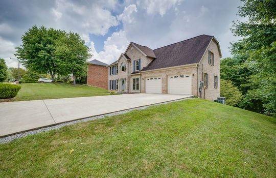 two story traditional brick home for lease, garage, garage doors, driveway, front door, brick exterior, front yard
