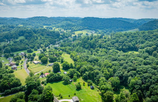 aerial photo of property, neighboring homes, mountain views