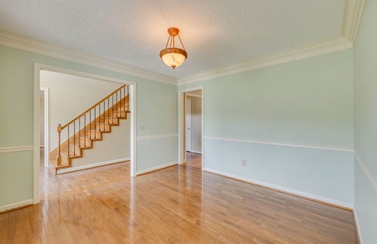 dining room, hardwood flooring, doors to hallway