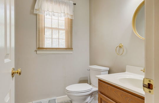 bathroom, sink, toilet, tile flooring, window
