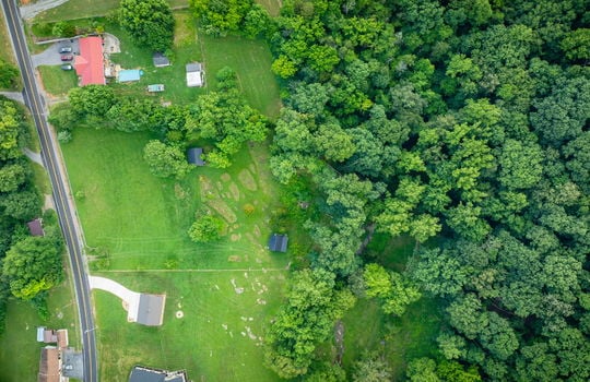 aerial photo of property, road, land, cabin, shed, trees, neighboring homes