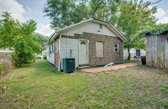 bungalow, back of home, exterior, back yard, side yard, fencing, shed