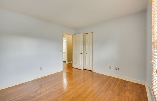bedroom, hardwood flooring, closet, window