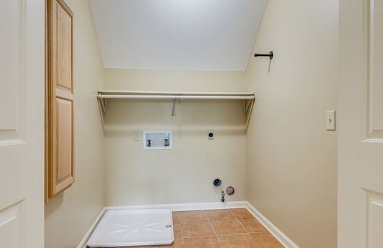 laundry room, tile flooring, laundry hookups