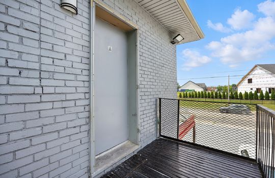 studio apartment, upstairs, brick exterior, porch, front door