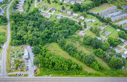 commercial property for sale, 5.62+/- acres, stone drive kingsport tn, neighboring homes, neighboring businesses, mountain views, aerial photo, road
