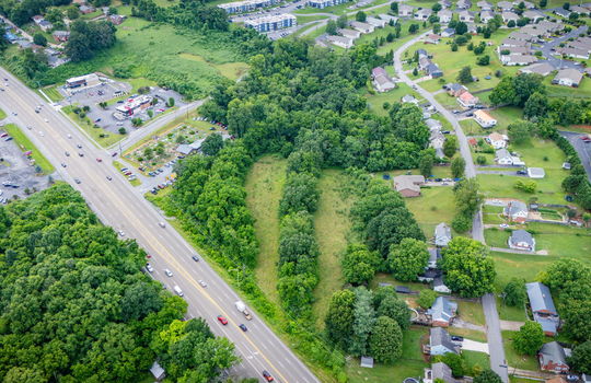 commercial property for sale, 5.62+/- acres, stone drive kingsport tn, neighboring homes, neighboring businesses, mountain views, aerial photo, road